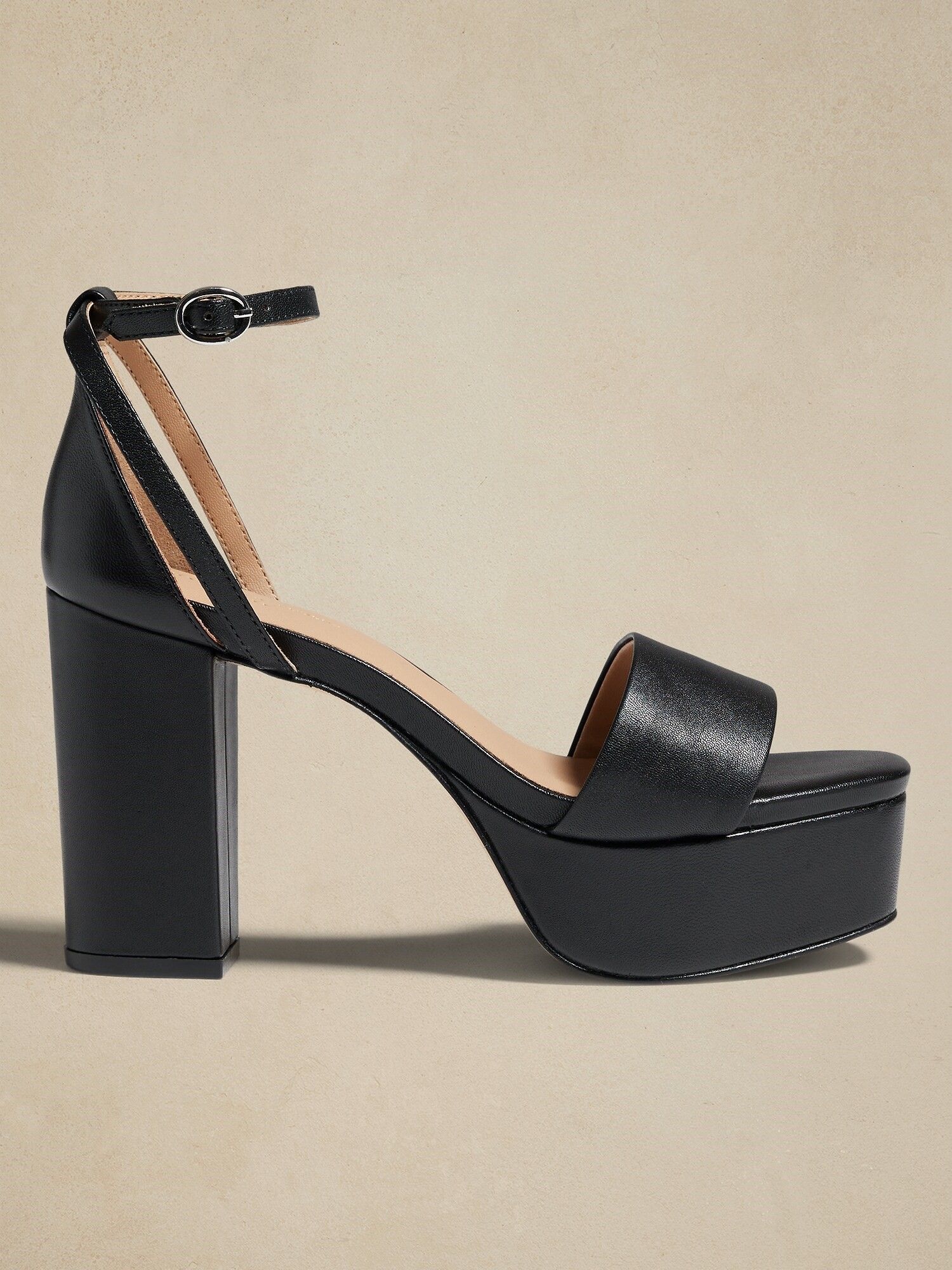 Black leather store platform pumps