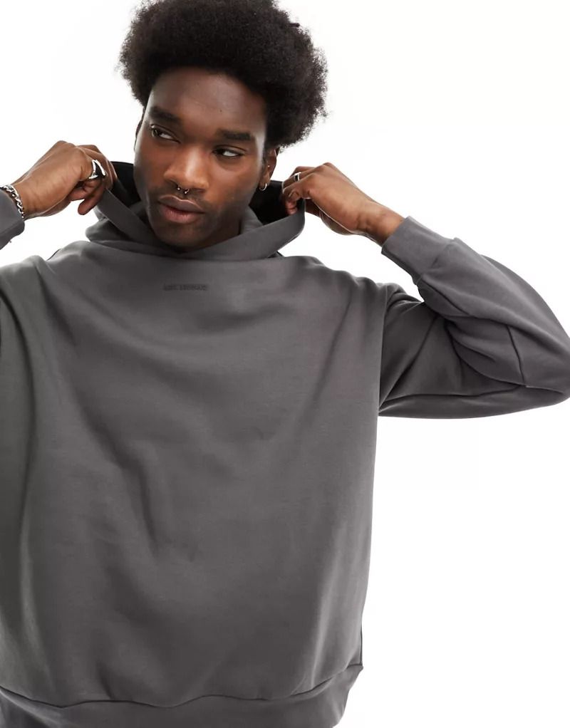 로고 Kastiger Kapuzenpullover in Anthrazit mit farblich abgestimmtem Logo 205691179ANTHRAZIT