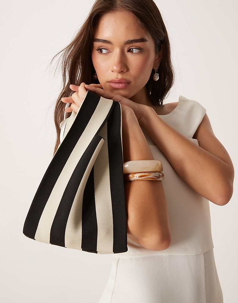 클러치 스트라이프 Clutch in Schwarzweiß gestreift mit Schlaufenhenkel 208416680Schwarz-weiß gestreift
